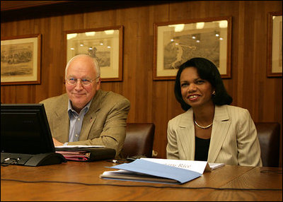 Vice President Dick Cheney and Secretary of State Condoleezza Rice smile while participating in a video teleconference from Camp David, Md. with President Bush and Iraqi Prime Minister Nouri al-Maliki in Baghdad, Tuesday, June 13, 2006.