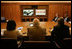 Vice President Dick Cheney, Secretary of Defense Donald Rumsfeld, right, and Secretary of State Condoleezza Rice, left, participate in a video teleconference from Camp David, Md., Tuesday, June 13, 2006 as President Bush meets Iraqi Prime Minister Nouri al-Maliki in Baghdad. The President expressed praise for Prime Minister Maliki's efforts in assembling a strong and diverse unity government in Iraq and said, "I want to thank you for giving me and my cabinet a chance to hear from you personally and a chance to meet the members of this team you've assembled. It's an impressive group of men and women, and if given the right help, I'm convinced you will succeed, and so will the world."