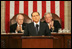 Vice President Dick Cheney and House Speaker J. Dennis Hastert applaud Italian Prime Minister Silvio Berlusconi during an address to a joint session of Congress, Wednesday, March 1, 2006. The Prime Minister's speech to the joint session was part of a three-day visit to Washington that included a visit to the White House, where he met with President George W. Bush and discussed Italy's continued allied relationship with the US in the global war on terror.