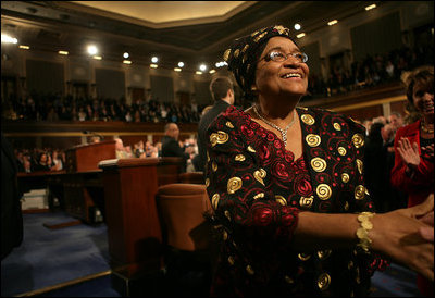 Liberian President Ellen Johnson-Sirleaf is welcomed by a Joint Meeting of Congress as she makes her way to the rostrum of the House Chamber before her remarks at the Capitol, Wednesday, March 15, 2006. President Johnson-Sirleaf is the first democratically elected female president of an African country and won Liberia’s November 2005 presidential elections with a margin of almost 20% of the vote.