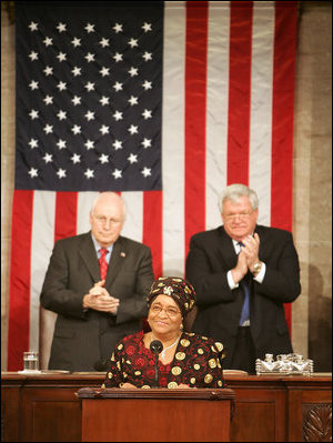 Vice President Dick Cheney and House Speaker J. Dennis Hastert applaud Liberian President Ellen Johnson-Sirleaf during an address to a Joint Meeting of Congress, Wednesday, March 15, 2006. The President’s speech marked the beginning of a multi-day trip to Washington that will include meetings with US officials in an effort to garner support as she leads her country in economic reconstruction and reform.