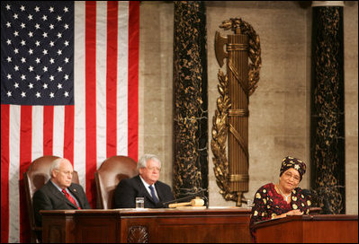 Vice President Dick Cheney and House Speaker J. Dennis Hastert listen as President Ellen Johnson-Sirleaf, Liberia and Africa’s first female head-of state, addresses a Joint Meeting of Congress held in her honor at the Capitol, Wednesday, March 15, 2006.