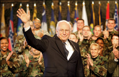 Vice President Dick Cheney waves in response to a warm welcome given by the troops and their families at a rally at Scott Air Base in Illinois, Tuesday, March 21, 2006.