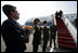 Officials from the United States and Lithuania line up on the tarmac to greet Vice President Dick Cheney and his wife Lynne Cheney upon their arrival Wednesday, May 3, 2006 to Vilnius, Lithuania. The Vice President's visit to Vilnius is the first stop in a three-nation, six-day trip that includes bilateral meetings with leaders of the Baltic and Black Sea regions at the Vilnius Conference 2006.