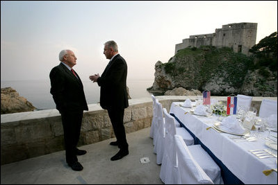 Vice President Dick Cheney talks with Croatian Prime Minister Ivo Sanader before a dinner meeting, Saturday, May 6, 2006, in the Old City of Dubrovnik, Croatia. The Vice President met with the Prime Minister to express U.S. support of Croatia's ambitions to become a member of the transatlantic community through integration into NATO and the European Community.