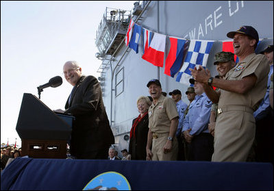 Vice President Dick Cheney gets a laugh from Navy commanders on stage as he makes a joke during an address to over 4,000 sailors and Marines from the flight deck of the amphibious assault ship USS Bonhomme Richard docked at Naval Station San Diego.