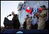 Vice President Dick Cheney gets a laugh from Navy commanders on stage as he makes a joke during an address to over 4,000 sailors and Marines from the flight deck of the amphibious assault ship USS Bonhomme Richard docked at Naval Station San Diego.