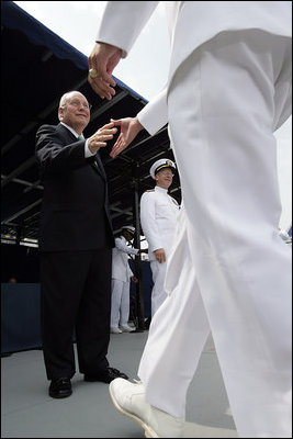 Vice President Dick Cheney greets each graduate as they receive their diplomas during the U.S. Naval Academy graduation in Annapolis, Maryland, Friday, May 27, 2005. During the ceremony the Vice President delivered the commencement address to the Class of 2006 and said, "As of today, you, the Custodians of Liberty, will begin writing your own chapter of excellence and achievement for the United States Armed Forces. As military officers you will bring relief to the helpless, hope to the oppressed. You will protect the United States of America in a time of war, and you'll help to build the peace that freedom brings.