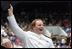 A graduate celebrates after receiving his diploma from Vice President Dick Cheney during the Graduation and Commissioning Ceremony for the U.S. Naval Academy Class of 2006, Friday, May 26, 2006 in Annapolis, Maryland.