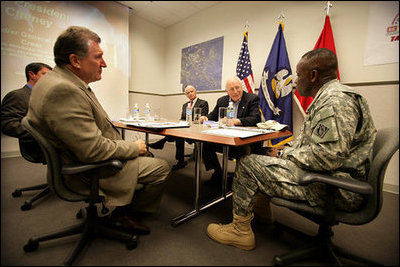 Vice President Dick Cheney speaks with Brigadier General Robert Crear, Commander of the Mississippi Valley Division of the U.S. Army Corps of Engineers, during a briefing on Hurricane Katrina recovery held at the New Orleans Port Authority in New Orleans, La., Thursday, October 12, 2006. The U.S. Army Corps of Engineers has been working to address flood problems along the Mississippi River since the 1800's and is responsible for rebuilding the 169 miles of levees in the southeast Louisiana area that sustained damage as a result of Katrina.