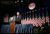 Vice President Dick Cheney delivers remarks on the economy and the global war on terror, Tuesday, September 19, 2006, at the National Automobile Dealers Association 2006 Legislative Conference in Washington, D.C. Seated on stage is Phil Brady, President of the National Automobile Dealers Association. 