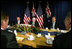 Vice President Dick Cheney is flanked by Tony Abbott, left, Australian Minister for Health and Ageing, and Robert McClelland, Shadow Minister for Foreign Affairs, during a breakfast meeting Friday, Feb. 23, 2007, at the Shangri-La Hotel in Sydney.