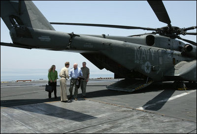  USS John C. Stennis Strike Group Commander Rear Admiral Kevin Quinn greets Vice President Dick Cheney and his daughter Liz Cheney, left, upon their arrival, Friday, May 11, 2007, to the aircraft carrier John C. Stennis in the Persian Gulf. 