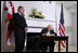 Vice President Dick Cheney signs his condolences for the victims of the recent conflict in Georgia during a visit to the Embassy of Georgia Monday, Aug. 18, 2008 in Washington, D.C.