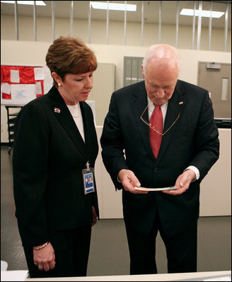 Vice President Dick Cheney examines an economic stimulus check Thursday, May 8, 2008, while on a tour of the Philadelphia Regional Financial Center with Director Betty Belinsky in Philadelphia. Through the summer months the Philadelphia Regional Financial Center will print over 11 million checks for disbursement to U.S. citizens as part of the Economic Stimulus Act of 2008.