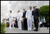 Vice President Dick Cheney poses for a photograph with a U.S. Coast Guard Academy graduate, Wednesday, May 21, 2008, during commencement exercises in New London, Conn.