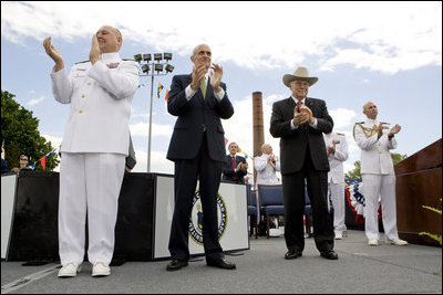 Vice President Dick Cheney is joined by Admiral Thad Allen, Commandant of the U.S. Coast Guard, left, and Secretary Michael Chertoff of Homeland Security, center, in applauding the graduates of the U.S. Coast Guard Academy, Wednesday, May 21, 2008, during commencement exercises in New London, Conn.