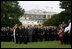 President George W. Bush and Mrs. Laura Bush stand with Vice President Dick Cheney and Mrs. Lynne Cheney and staff, family and friends Thursday, Sept. 11, 2008, in a South Lawn observance of the seventh anniversary of the September 11 terrorist attacks.