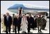 Vice President Dick Cheney, former Secretary of State Colin Powell, and former President George H.W. Bush are escorted from the plane by members of the Saudi delegation before meeting with the newly crowned King Abdullah of Saudi Arabia Friday, August 05, 2005. Vice President Dick Cheney led a delegation to pay respects following the recent death of King Fahd.