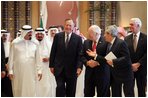 Vice President Dick Cheney and former President George H.W. Bush walks with newly crowned King Abdullah during a retreat at King Abdullah's Farm in Riyadh, Saudi Arabia Friday, August 5, 2005, following the death of his half-brother King Fahd who passed away August 1, 2005. Interpreter Gamal Helal, center, is also pictured.