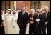 Vice President Dick Cheney and former President George H.W. Bush walks with newly crowned King Abdullah during a retreat at King Abdullah's Farm in Riyadh, Saudi Arabia Friday, August 5, 2005, following the death of his half-brother King Fahd who passed away August 1, 2005. Interpreter Gamal Helal, center, is also pictured.