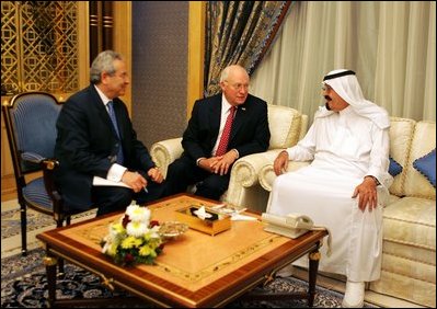 Vice President Dick Cheney speaks with newly crowned King Abdullah during a retreat at King Abdullah's Farm in Riyadh, Saudi Arabia Friday, August 5, 2005, following the death of his half-brother King Fahd who passed away August 1, 2005. Interpreter Gamal Helal, center, is also pictured.