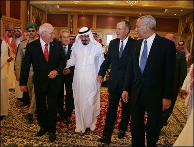 Vice President Dick Cheney walks with newly crowned King Abdullah, former President George H.W. Bush, and former Secretary of State Colin Powell during a retreat at King Abdullah's Farm in Riyadh, Saudi Arabia Friday, August 5, 2005, following the death of Abdullah's half-brother King Fahd who passed away August 1, 2005.