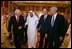 Vice President Dick Cheney walks with newly crowned King Abdullah, former President George H.W. Bush, and former Secretary of State Colin Powell during a retreat at King Abdullah's Farm in Riyadh, Saudi Arabia Friday, August 5, 2005, following the death of Abdullah's half-brother King Fahd who passed away August 1, 2005.