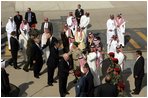 Vice President Dick Cheney, former President George H.W. Bush and former Secretary of State Colin Powell shake hands before their departure back to the United States upon the conclusion of their meeting with King Abdullah following the recent death of King Fahd, Friday, August 05, 2005. Vice President Dick Cheney led a delegation to pay respects following the recent death of King Fahd.