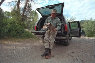 Miles away from anywhere, the Vice President trades in suits for boots and ties for fishing line. 