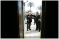 Vice President Dick Cheney and Iraqi President Jalal Talibani enter a meeting with Ambassador to Iraq Zalmay Khalilzad inside the Green Zone, Sunday Dec. 18, 2005.