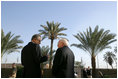 Vice President Dick Cheney speaks with Zalmay Khalilzad, US Ambassador to Iraq, inside the Green Zone, Sunday Dec. 18, 2005.