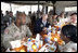 Vice President Dick Cheney has lunch with US and Iraqi troops at the 9th Mechanized Infantry Division Headquarters, a training facility for Iraqi troops, Sunday Dec 18, 2005.