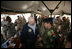 Vice President Dick Cheney has lunch with US and Iraqi troops at the 9th Mechanized Infantry Division Headquarters, a training facility for Iraqi troops, Sunday Dec 18, 2005.