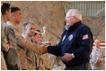 Vice President Dick Cheney attends a rally with US troops at Al-Asad Airbase in Iraq, Dec. 18, 2005.