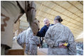 Vice President Dick Cheney attends a rally with US troops at Al-Asad Airbase in Iraq, Dec. 18, 2005.