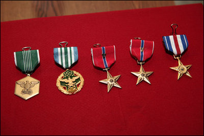 Five U.S. service medals presented by Vice President Dick Cheney are seen displayed Thursday, March 20, 2008 during Vice President Cheney’s visit to Bagram Air Base. “We know the work is hard, we know the conditions are tough, we know the deployments are hard on families,” said the Vice President to U.S. troops, adding, “But we're impressed beyond measure by all of the accomplishments that you've made.” From left, the U.S. Army Commendation Medal, the Joint Service Commendation Medal, two Bronze Star Medals and a Silver Star Medal.