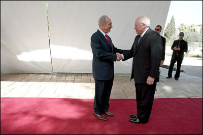 Vice President Dick Cheney is greeted by Israeli President Shimon Peres Sunday, March 23, 2008 for a meeting at the presidential residence in Jerusalem.