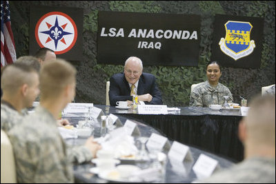 Vice President Dick Cheney talks with U.S. troops during breakfast Tuesday, March 18, 2008, at Balad Air Base, Iraq. Following a day of meetings in Baghdad the Vice President and Mrs. Cheney were overnight guests at the base. White House photo by David Bohrer