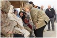 Vice President Dick Cheney and Mrs. Lynne Cheney greet Pakistani patients awaiting care at the 212th M.A.S.H. Unit near the earthquake's epicenter Tuesday, Dec. 20, 2005.