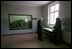 Standing in a room formerly used as barracks for Nazi prisoners, a museum guide explains to Vice President Dick Cheney about the atrocities committed there at the Auschwitz-1 Nazi concentration camp, near Krakow, Poland, Friday, Jan. 28, 2005. The window at left shows a display of empty cans of Zyklon-B gas used against former prisoners. Vice President Cheney was there to take part in ceremonies commemorating the 60th Anniversary of the liberation of the Auschwitz camps. 