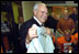 Moments before the dedication ceremony of the Cheney Alumni Field, Vice President Dick Cheney talks with the Natrona County High School football team in the locker room in Casper, Wyo., Sept. 20, 2002. 