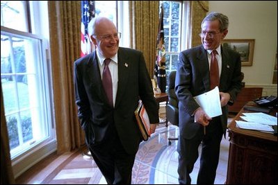 Vice President Dick Cheney and President George W. Bush joke with each other after a meeting in the Oval Office Jan. 24, 2002.