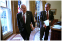 Vice President Dick Cheney and President George W. Bush joke with each other after a meeting in the Oval Office Jan. 24, 2002.