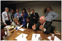 Immediately after the Sept. 11 terrorist attacks, Vice President Dick Cheney and senior staff gathered in the Presidential Emergency Operations Center. White House staff collected and discussed information as the day unfolded, and they kept in contact with the President. Photographed are Counselor Karen Hughes (seated left), National Security Advisor Dr. Condoleezza Rice (seated right), Deputy Chief of Staff Josh Bolten (far left), Director of Media Affairs Tucker Eskew, Assistant to the President Nick Calio, Counselor to the Vice President Mary Matalin, Chief of Staff for the Vice President Lewis Libby, and Director of the National Economic Council Larry Lindsey (right).