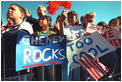 Children put their warm greetings into cool words for Vice President Dick Cheney as he disembarks from Air Force Two Feb. 20, 2002.