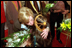 Two children greet Vice Present Dick Cheney and Mrs. Cheney with bouquets of flowers upon their arrival at Dasman Palace in Kuwait City, Kuwait, March 18, 2002.