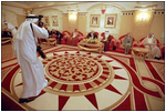 As an official photographer records the moment, Vice President Dick Cheney and King Hamad of Bahrain meet in Manama, Bahrain, March 17. "My role in part has been to travel around the region and let all of our friends in the region know the importance of our commitment to try to resolve this conflict," said the Vice President later during a press conference with Crown Prince Salman of Bahrain at Shaikh Hamad Palace.