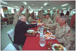 Stationed in Egypt, American troops are participating in an 11-country international peacekeeping force called the Multinational Force of Observers. Here, they share conversation and lunch with Vice President Dick Cheney during his visit to the base March 13. The MFO is an international peacekeeping force established by Egypt and Israel to monitor the security arrangements of their Treaty of Peace.