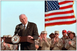 Discussing American initiatives in the war, Vice President Dick Cheney speaks to troops stationed at Al-Udeid Airbase in Qatar, March 17. "That is our first objective: To shut down terrorist camps wherever they are and to disrupt terrorist plans and to bring terrorists to justice," said the Vice President. "We'll make life very hard for them, by driving them from place to place until there is no place left to hide."